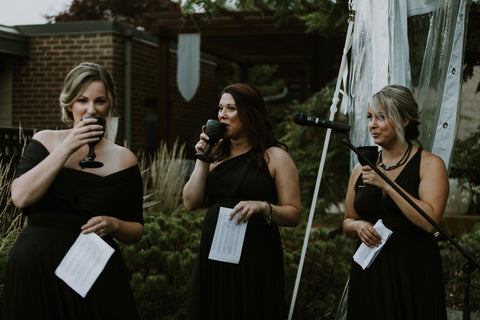 Maids of honor toast the bride in Henkaa Night Black Sakura Maxi infinity dresses worn for medieval themed Caledon Ontario wedding.