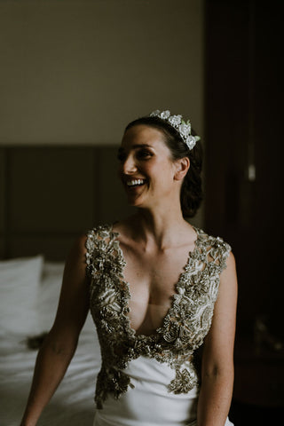 Bride with crown laughing in ornate wedding dress featured on Henkaa A Brides Story: Lauren & Alex on the Henkaa infinity dress blog.
