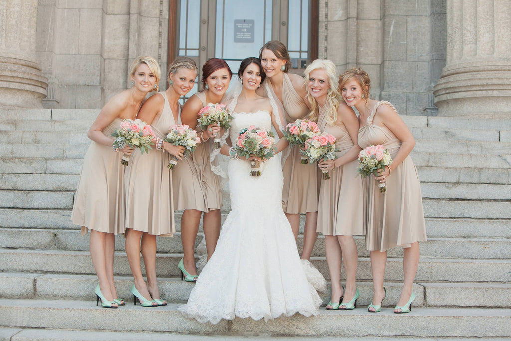 Garden-themed wedding - bride and six bridesmaids wearing Henkaa convertible dresses
