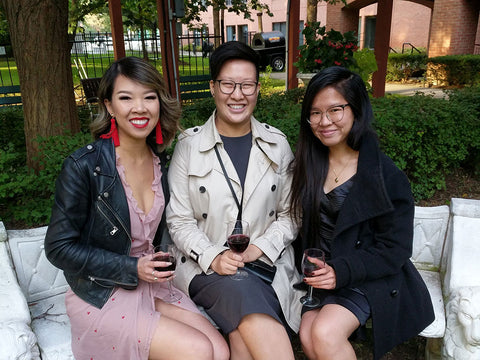 Older sister Sylvia Wong left, younger sister Caitlyn Wong middle, and Samantha Wong right sit together.
