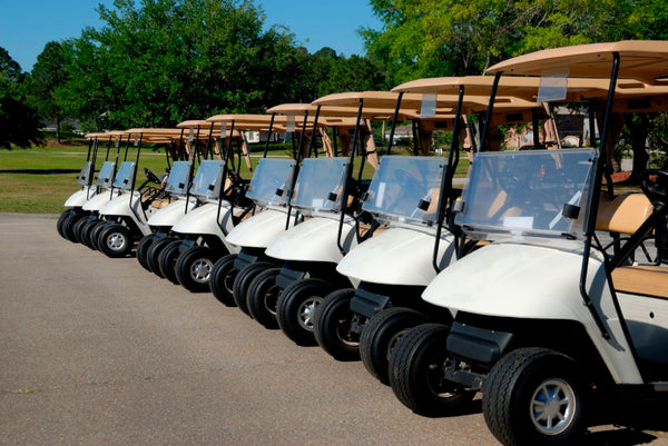 golf carts lined up for tournament