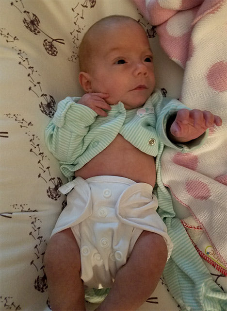 preemie baby in cloth diaper cover