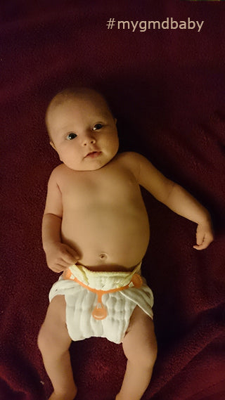 baby in small prefold diaper