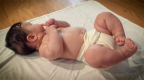 muslin flat diaper wrapped on baby