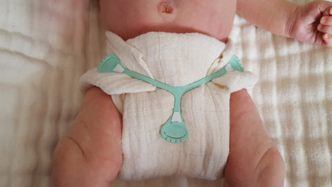 muslin flat diaper on a baby