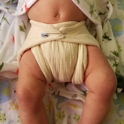 pinned muslin flat diaper on 3.5 month old 13 lb baby