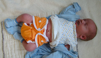 newborn baby in size one Thirsties Duo mango snap diaper cover