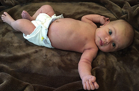 newborn baby in newbie cloth diaper