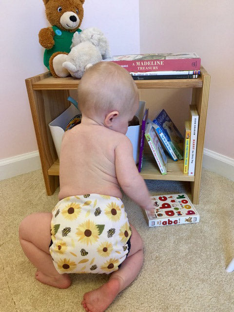 thirsties pocket diapers on a baby