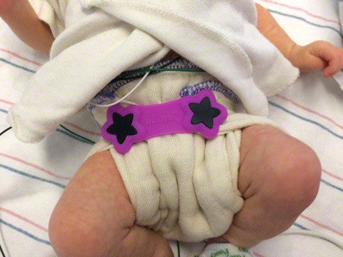 premature baby in preemie cloth diaper