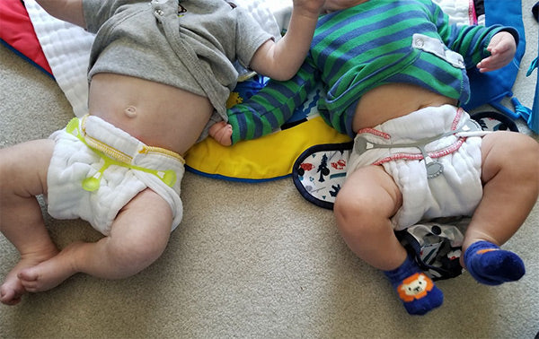 twins in prefold diapers size comparison 5 month old babies