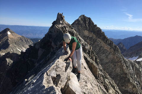 Mackenzie St. Onge climbing a mountain