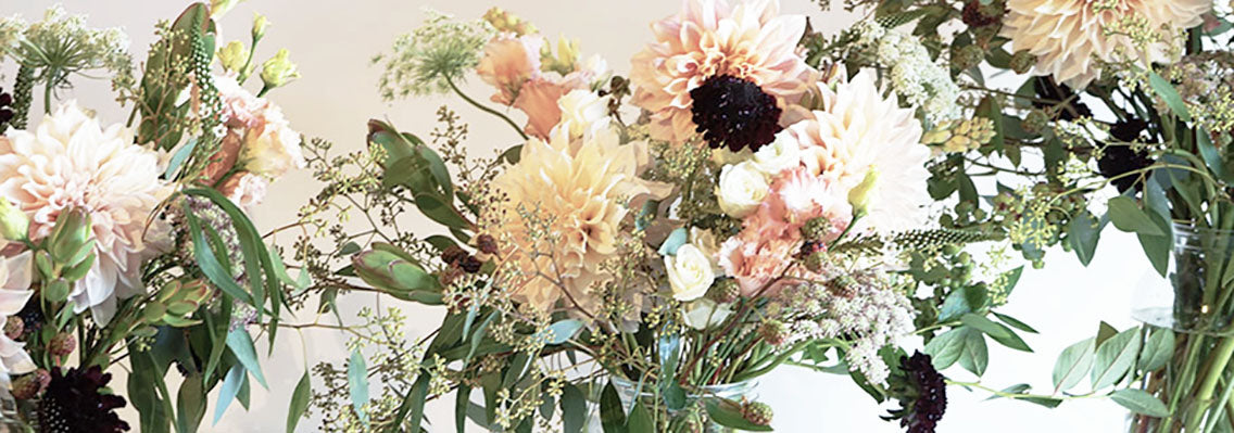 peach dahlias and lisianthus, white spray roses, black scabiosa and lots of foliage