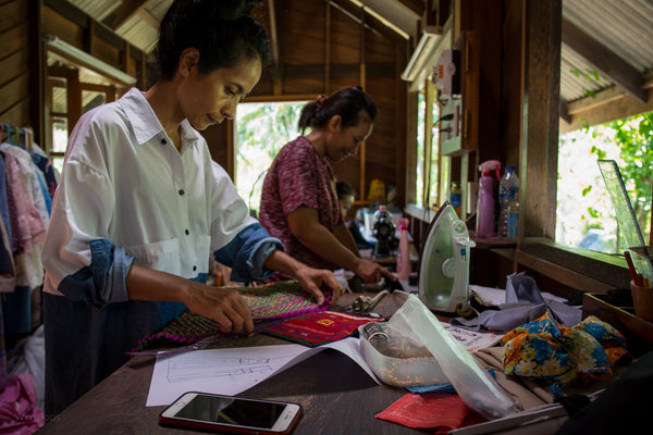 Nuichan sisters at work creating new designs from hill tribe fabrics