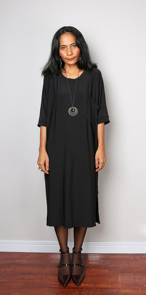 black mid length dress with sleeves