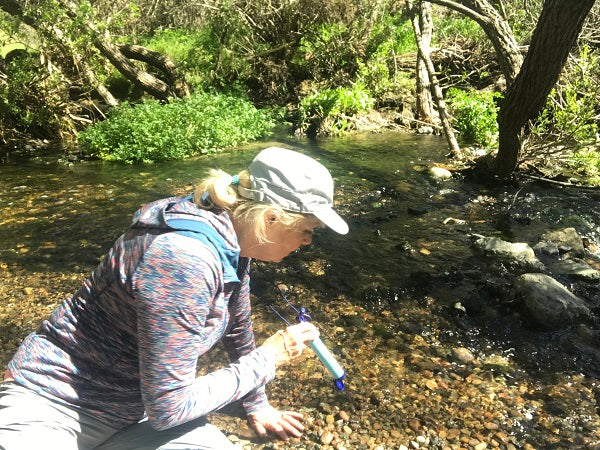 Using a LifeStraw in the stream