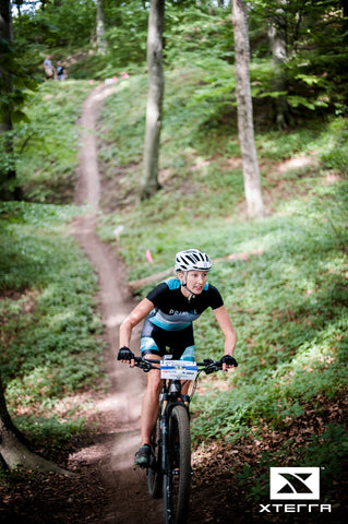 Nicole biking with her customised clothes from Primal Europe