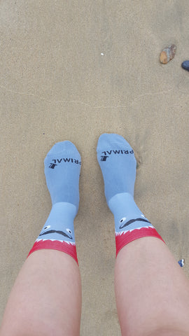 Rachel relaxing at the beach with her Primal Europe Sharky Socks