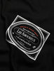 Men's AMIRI Les Amoureux Label Tee in Black. F0M03237CJBLK