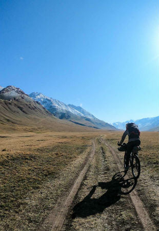 Katie cycling in Kyrgyzstan