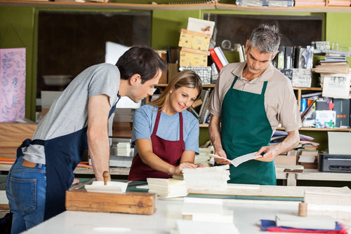 Male-and-female-workers-working-together-in-paper-factory