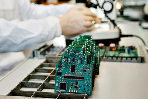 Microchip production factory. Technological process. Assembling the board. Chip. Professional. Technician. Computer expert. Manufacturing. Engineering