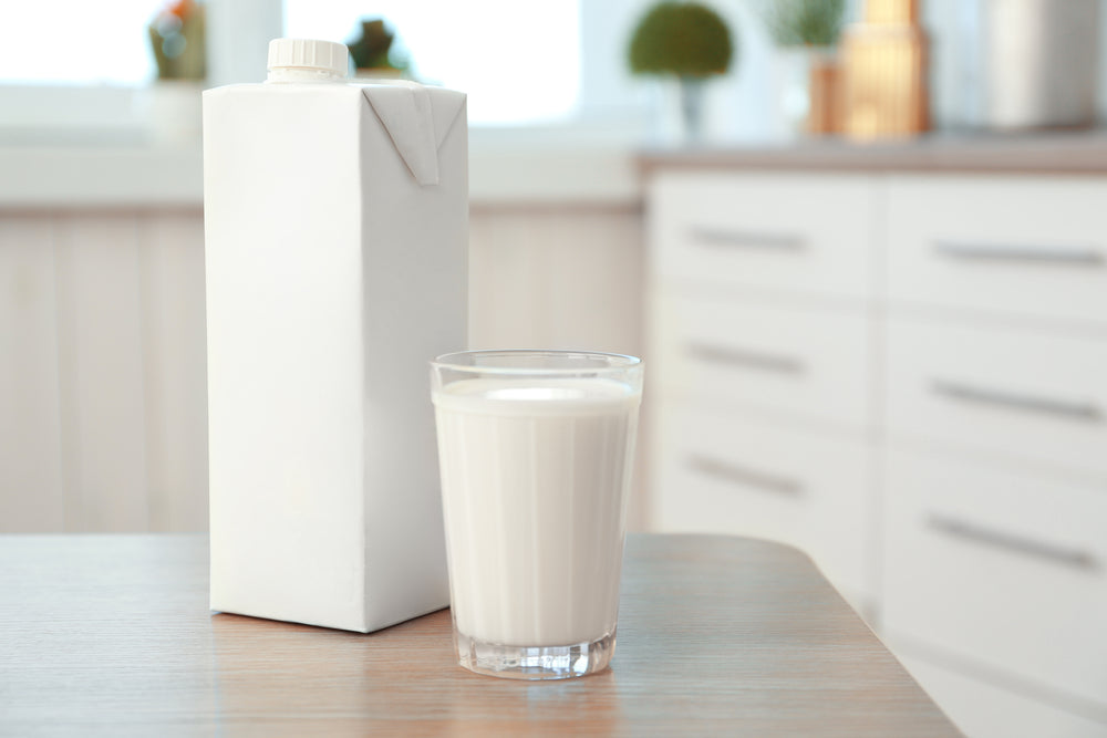 carton box glass milk on table