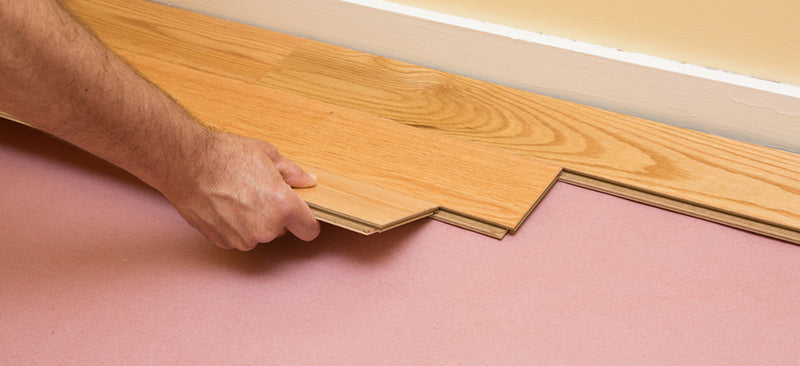 hardwood floor being installed by hand