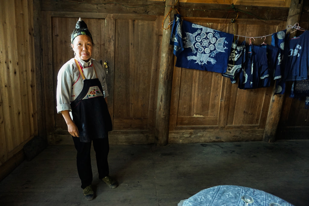 Miao woman artisan batik indigo Guizhou China handicraft