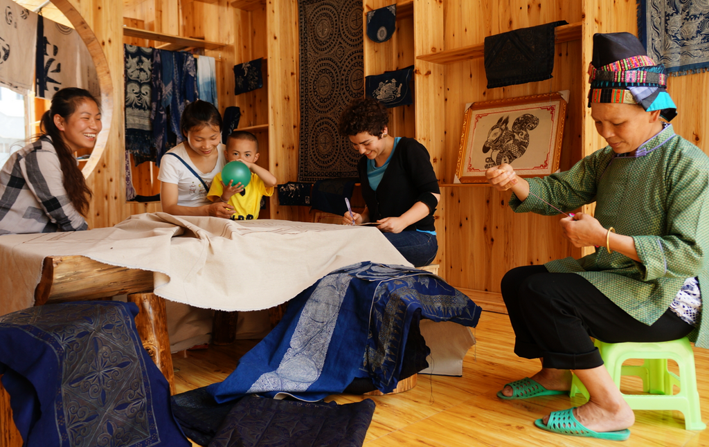young millennial woman artisan China Miao batik indigo