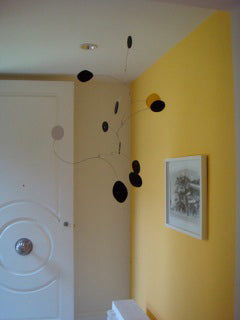 Black kinetic art mobile hanging in Beverly Hills home by AtomicMobiles.com