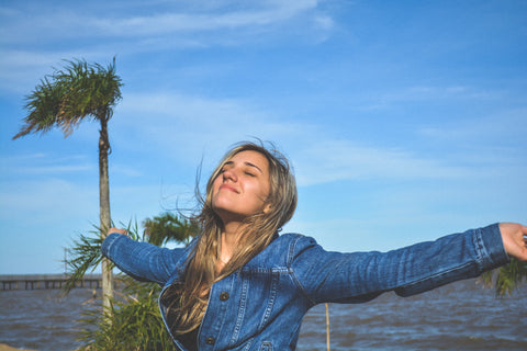 A girl with her hands in the air.