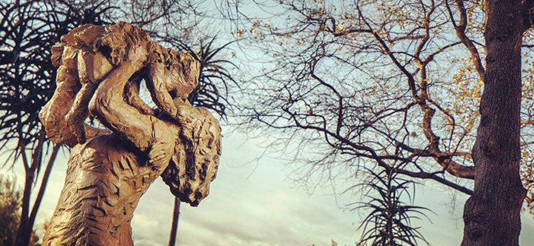 Sculpture outside of woman holding a baby at a Franschhoek art gallery