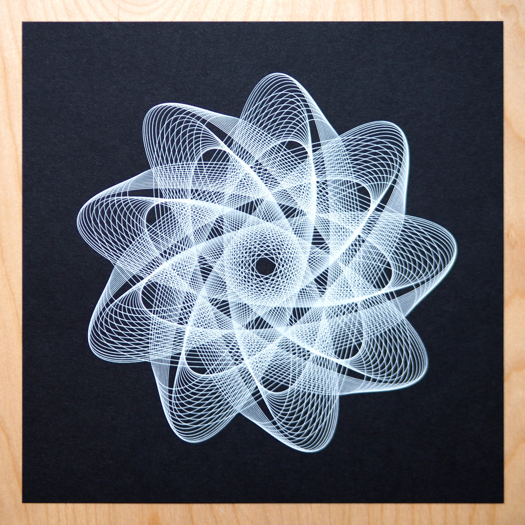 generative spirograph art by michelle chandra drawn with axidraw pen plotter and white gelly roll pen on black paper from french paper co