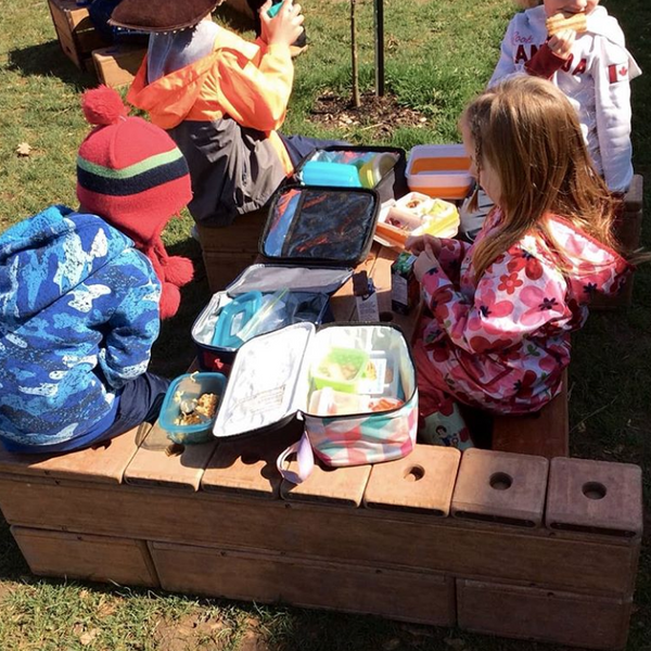 Picnic lunch with outlast blocks and elementary age childrent
