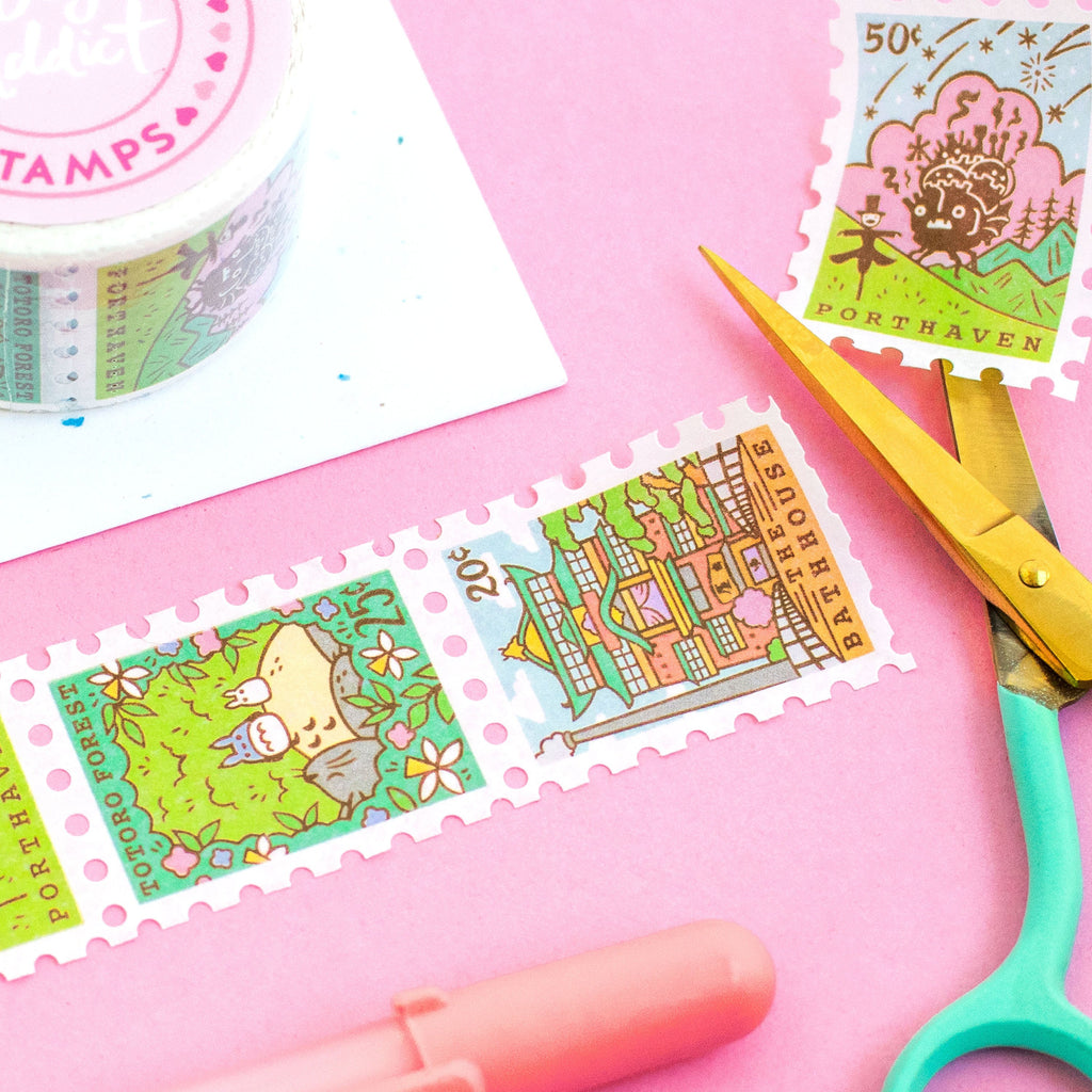 Paper Washi Tape that features Japanese Anime designs: Porthaven, Forest Spirits, The Bathhouse. With gel pen and crafting scissors on plain background.