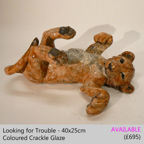 lion cub sculpture big cat sculpture, raku fired ceramic sculpture by Lesley D McKenzie