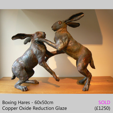 boxing hares, boxing hare sculpture - raku fired ceramic hare sculpture by Lesley D McKenzie, art and animal sculpture