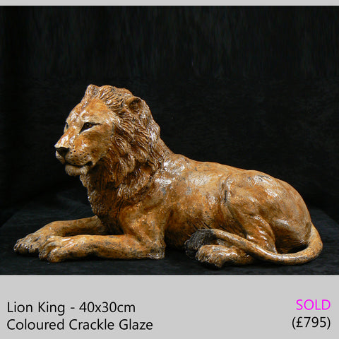 lion sculpture big cat sculpture, raku fired ceramic sculpture by Lesley D McKenzie