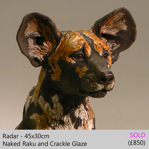 african wild dog sculpture
