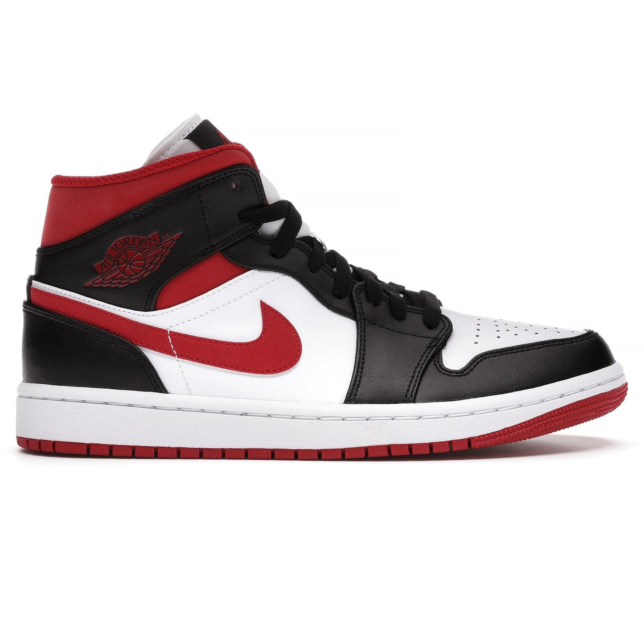 black and white jordans with red tick