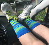 John wearing blue green socks