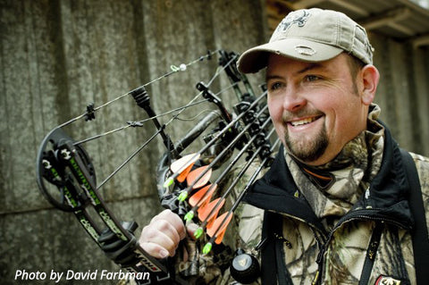 Bone Collector's Travis "T-Bone" Turner poses with his archery equipment for an Outdoor Channel photo shoot.