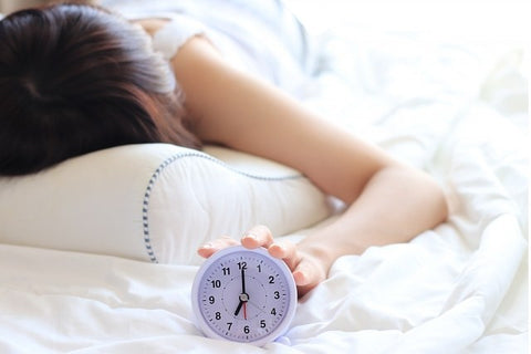 Woman Snoozing in Bed