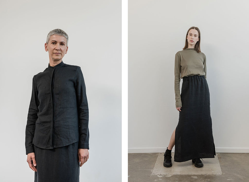 Woman in black linen shirt and woman in black organic linen skirt