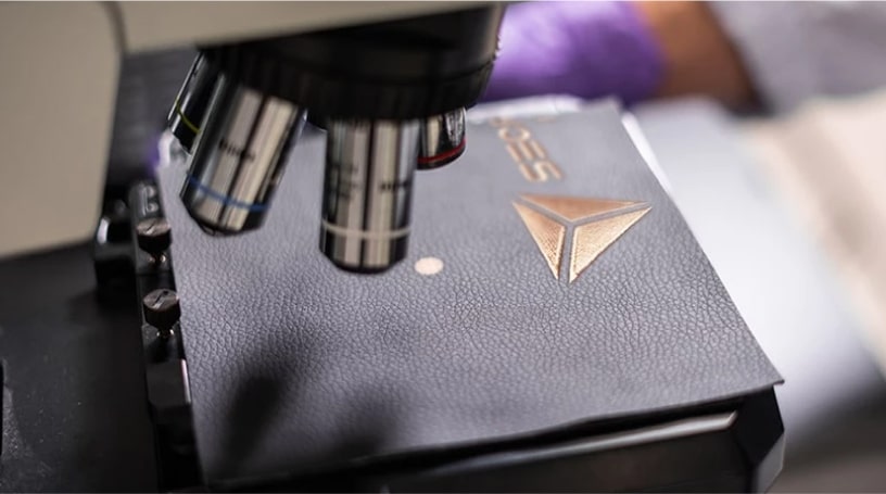 PU leather being examined and tested for quality control