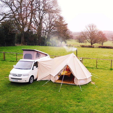 White T5 VW camper van and glawning with a smoking chimney