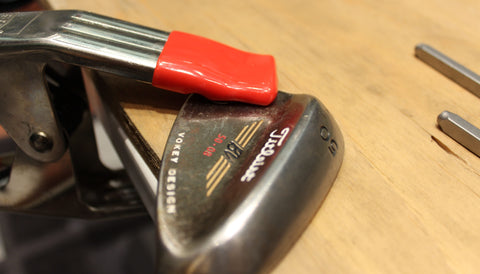 Secure your golf club to the table with the golf club clamp