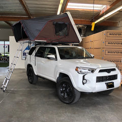 white 2017 Toyota 4Runner with iKamper Skycamp 4x v2 installed on Rhino Rack crossbars at Rhino Adventure Gear California