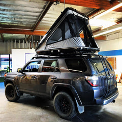 2018 Toyota 4Runner with black James Baroud Discovery Standard Roof Top Tent on Gobi Roof Rack installed at Rhino Adventure Gear in California